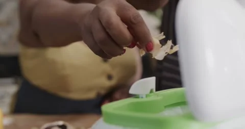 Mid section of senior african american couple throwing food waste out in ktichen Stock Footage 339650698