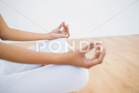 Mid section of slender young woman meditating Stock Photos