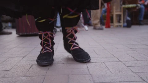 Mid section of woman dancing while the drummers perform during drum circle Stock Footage 103434308
