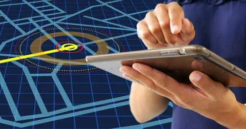 Mid section of a woman using a digital tablet against navigation map line scheme Stock Photos