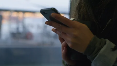 Mid section of woman using mobile phone Stock Footage 100048719