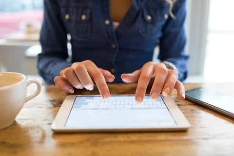Mid section of woman using table computer Foto stock