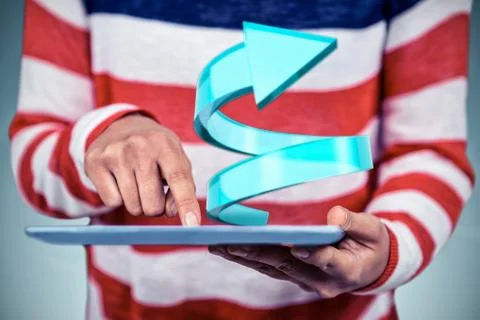 Mid section of woman using tablet against grey vignette Foto stock