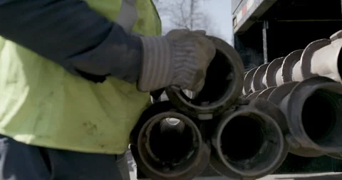 Mid section of worker arranging drill augers Stock Footage 145282743