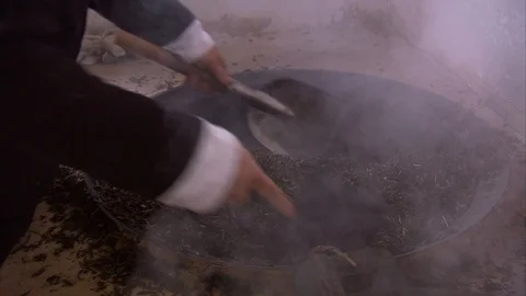 Mid section of worker preparing tea leaves in the factory Stock-Footage 88545777