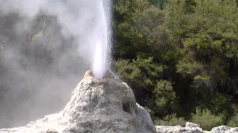 Mid shot centered geyser erupting Stock Footage 2525156