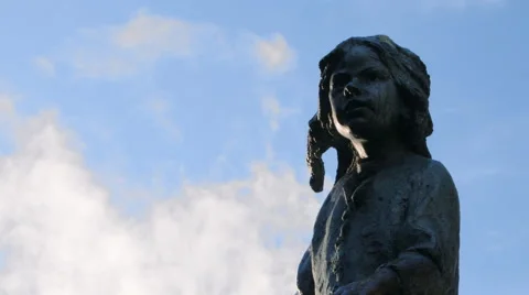 Mid Shot of Child Statue with Clouds Passing in Background Stock Footage 61485188