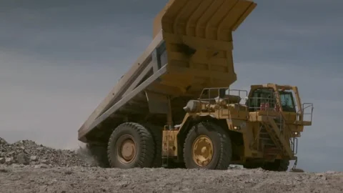 Mid shot of a construction vehicle dumping its load Stock Footage 312400453