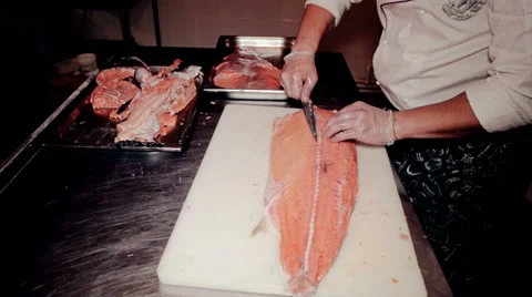 Mid shot the cook cut fresh red fish Stock Footage 65507651