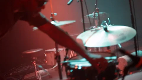 Mid shot of drumkit on stage bathed in pink and green light Stock Footage 107622171