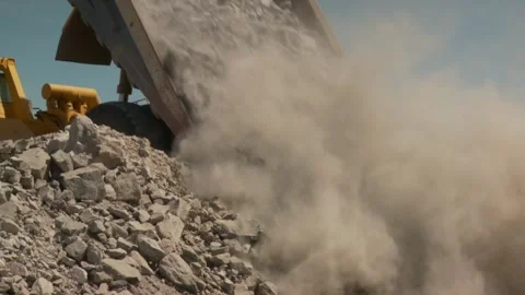Mid shot of a dump truck dumping its load Stock Footage 312400448