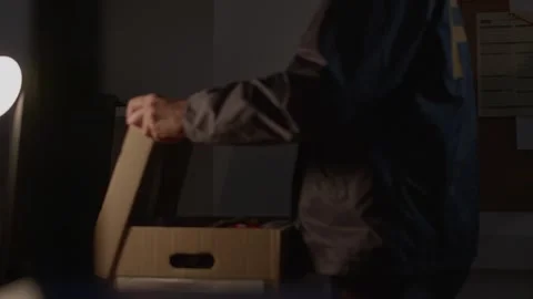 Mid shot FBI agent opening up Evidence Paper Work Box Stock Footage 312455754