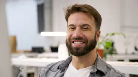 Mid-shot front view of cheerful young professional looking at camera while Stock Footage 277954830