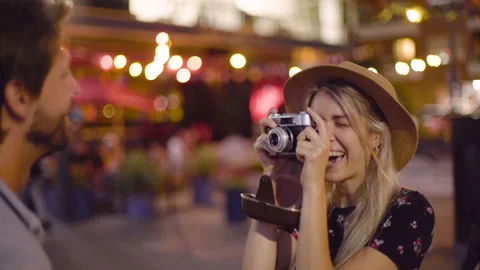 Mid-shot front view of cheerful young woman taking a photo of her husband with Stock Footage 277970181