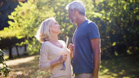 Mid-shot front view of cheerful group of coworkers reviewing details of Stock Footage 278018316
