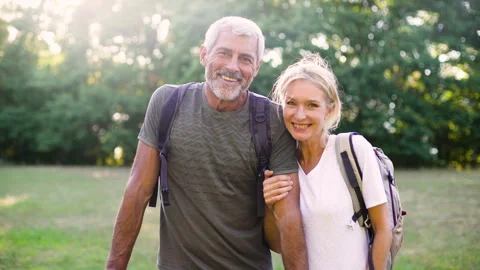 Mid-shot front view of cheerful group of coworkers reviewing details of Stock Footage 278018413