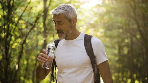 Mid-shot front view of cheerful group of coworkers reviewing details of Stock Footage 278019396