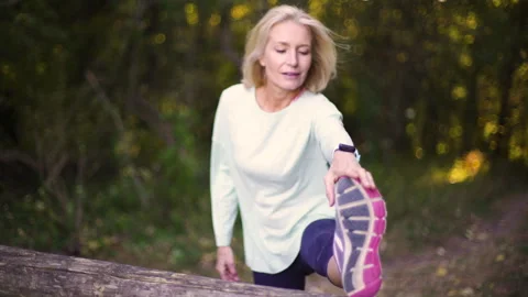 Mid-shot front view of cheerful group of coworkers reviewing details of Stock Footage 278019566