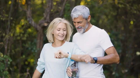 Mid-shot front view of cheerful group of coworkers reviewing details of Stock Footage 278019616