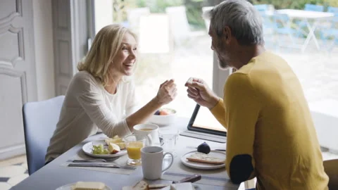 Mid-shot front view of cheerful group of coworkers reviewing details of Stock Footage 278019832