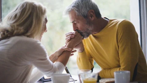 Mid-shot front view of cheerful group of coworkers reviewing details of Stock Footage 278019880