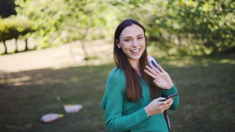 Mid-shot front view of cheerful group of coworkers reviewing details of Stock Footage 278020388
