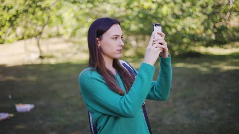 Mid-shot front view of cheerful group of coworkers reviewing details of Stock Footage 278020392
