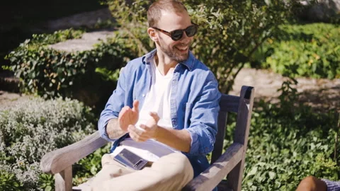 Mid-shot front view of cheerful group of coworkers reviewing details of Stock Footage 278020426