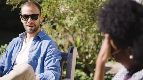 Mid-shot front view of cheerful group of coworkers going over details of new Stock Footage 278020483