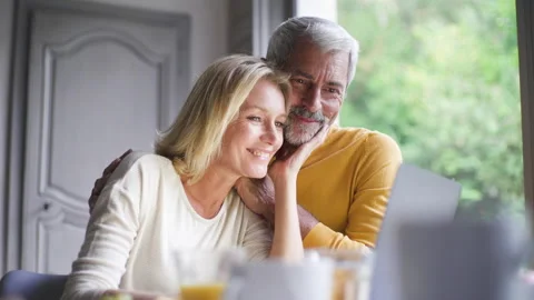 Mid-shot front view of cheerful group of coworkers reviewing details of Stock Footage 278020504