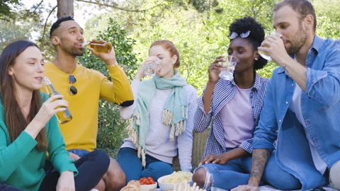 Mid-shot front view of cheerful group of coworkers going over details of new Stock Footage 278020880