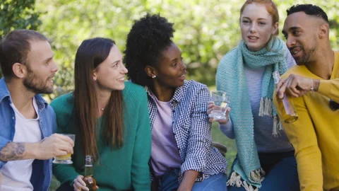 Mid-shot front view of cheerful group of coworkers going over details of new Stock Footage 278020989