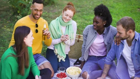 Mid-shot front view of cheerful group of coworkers going over details of new Stock Footage 278021280