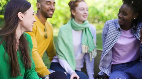 Mid-shot front view of cheerful group of coworkers going over details of new Stock Footage 278021300