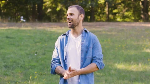 Mid-shot front view of cheerful group of coworkers going over details of new Stock Footage 278022138