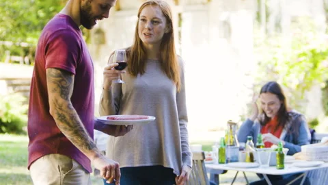 Mid-shot front view of cheerful group of coworkers going over details of new Stock Footage 278022323