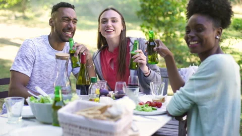 Mid-shot front view of cheerful group of coworkers going over details of new Stock Footage 278022413