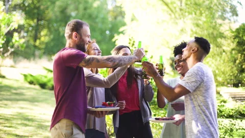 Mid-shot front view of cheerful group of coworkers going over details of new Stock Footage 278022709