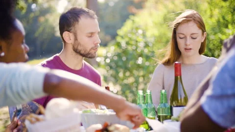 Mid-shot front view of cheerful group of coworkers going over details of new Stock Footage 278022861