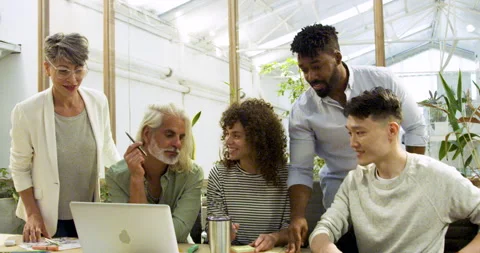 Mid-shot front view of diverse group of coworkers looking at camera while taking Stock Footage 277947068