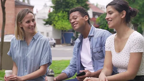 Mid-shot front view of diverse group of coworkers exchanging ideas for new Video stock 277963479