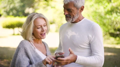 Mid-shot front view of diverse group of colleagues sharing ideas while working Stock Footage 278016541
