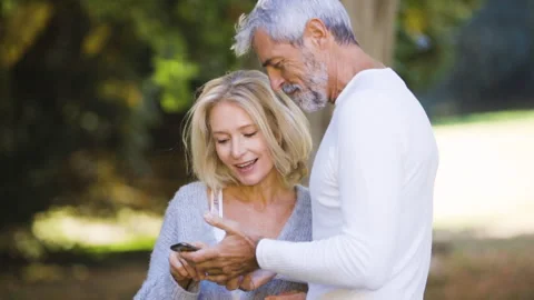 Mid-shot front view of diverse group of colleagues sharing ideas while working Stock Footage 278016695
