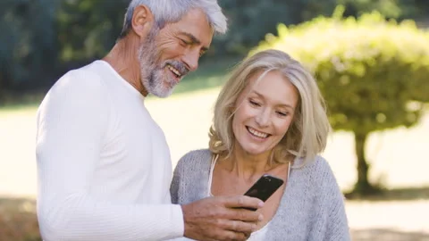 Mid-shot front view of diverse group of colleagues sharing ideas while working Stock Footage 278016801