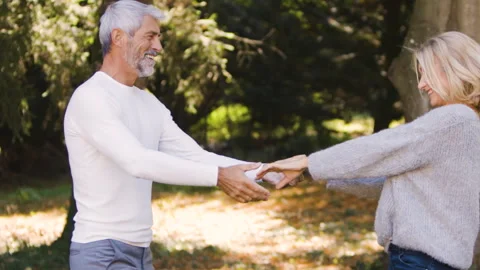 Mid-shot front view of diverse group of colleagues sharing ideas while working Stock Footage 278016994