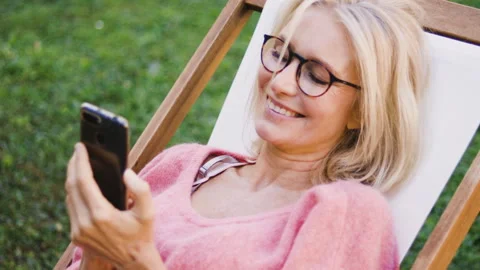 Mid-shot front view of diverse group of colleagues sharing ideas while working Stock Footage 278017222