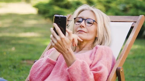 Mid-shot front view of diverse group of colleagues sharing ideas while working Stock Footage 278017278