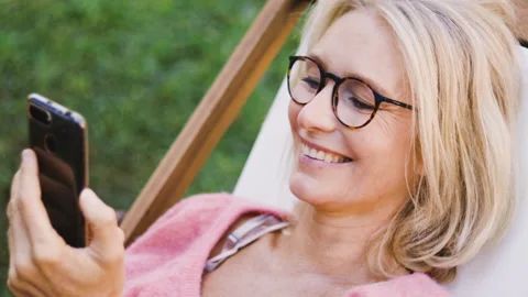 Mid-shot front view of diverse group of colleagues sharing ideas while working Video stock 278017347