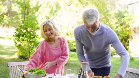 Mid-shot front view of diverse group of colleagues sharing ideas while working Stock Footage 278017772