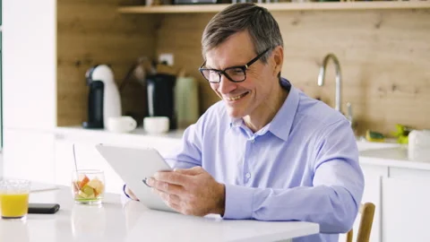 Mid-shot front view of diverse group of coworkers chatting and looking at Stock Footage 278040019